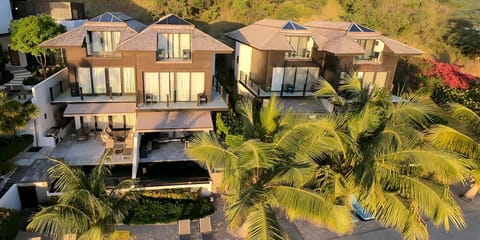 Stretch out in a lofty suite with panoramic ocean serenity.