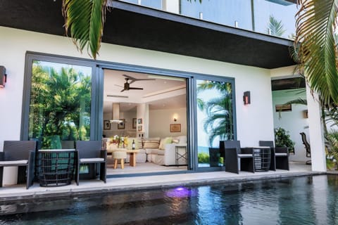 Glide from the pool straight into cool, open-plan lounging.