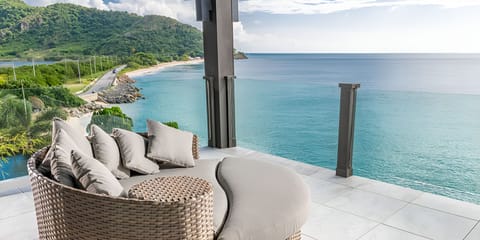 Sink into plush loungers while turquoise waves stretch endlessly.