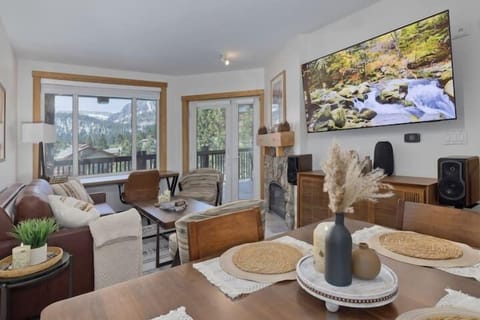 Open Living and Dining Areas with premium channel TV, gas fireplace and premium sound system.