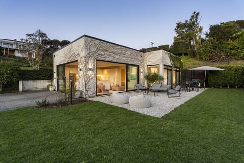 Welcome to The Ivy, a private designer retreat framed by lush greenery and coastal and city views