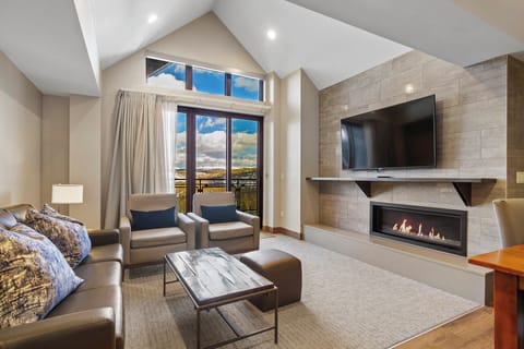 Living room with gas fireplace & deck