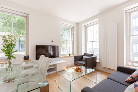 There is a dining table with chairs for 6 guests