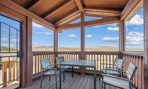 Enjoy meals or morning coffee at the outdoor dining table while taking in the open-air surroundings.