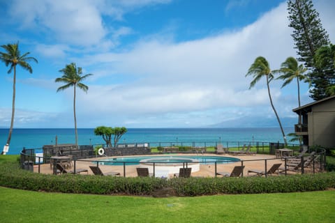 From the lanai, the view stretches past the pool and out over the ocean with Lana'i visible to the left and Moloka'i to the right.