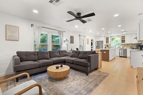 Gather on the spacious sectional in the open living area that flows right into the kitchen, keeping everyone connected.