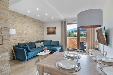 Relax in the stylish living room with a comfortable sofa and modern decor.