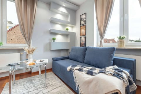 Relax in the stylish living room with a comfortable sofa and modern decor.
