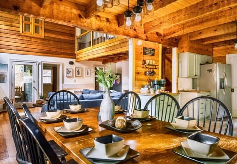 Gather with family and friends in this spacious rustic dining area, perfect for enjoying meals after a day of exploring Gatlinburg or Pigeon Forge.