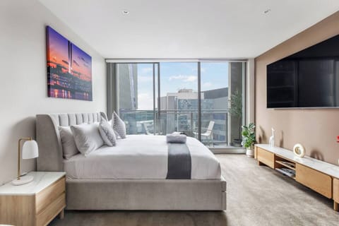 Kick back with your favourite shows from the comfort of bed, thanks to the wall-mounted TV just opposite.
