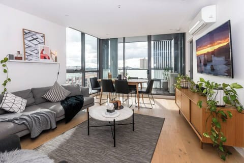 The apartment features a contemporary design with sufficient space for dining at the table or lounging on the couch watching your favourite film.