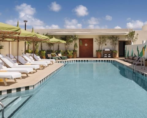 Rooftop pool with sun loungers