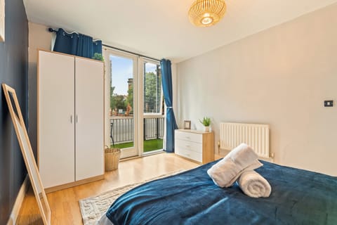 Bright bedroom with balcony access and calming modern touches