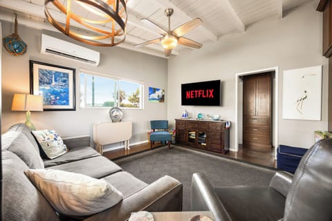 Kick back on comfortable leather and plush seating while streaming your favorite shows on Netflix after a day at the beach.