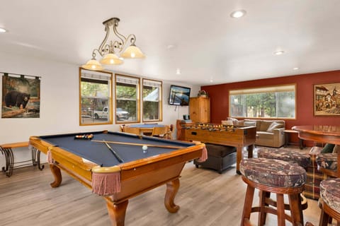 A game room with pool table, foosball, darts and poker game table are perfect for family fun, friendly competition, and unforgettable entertainment during your stay.