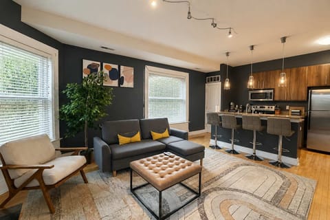 Living room — sectional, accent chair, and breakfast-bar seating for four