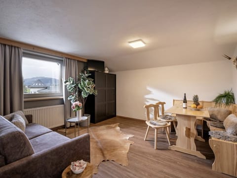 Westendorf vacation rental with bright living room, dining area, balcony and a quiet base near the village center, ski bus and Alpine trails.