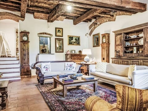Furniture, Interior Design, Flooring, Wood, Couch, Floor, Living Room, Table, Room, Picture Frame