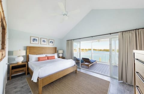 Wake up to sunlight and sweeping waterfront balcony views.