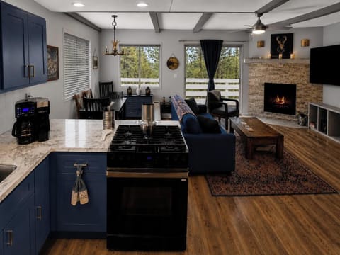 Living room opens to deck with mountain views.