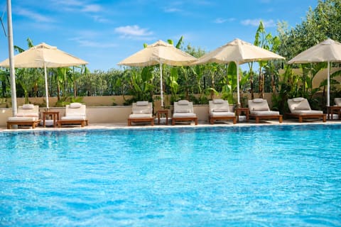 Seasonal outdoor pool, open 8:00 AM to 8:00 PM, free cabanas
