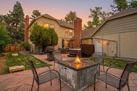 Welcome to Starsmore Manor! This four bedroom home sleeps twelve on a half acre corner lot just down the street from The Broadmoor, with a fire table, a hot tub, and a wide patio waiting out back when the evening rolls around.