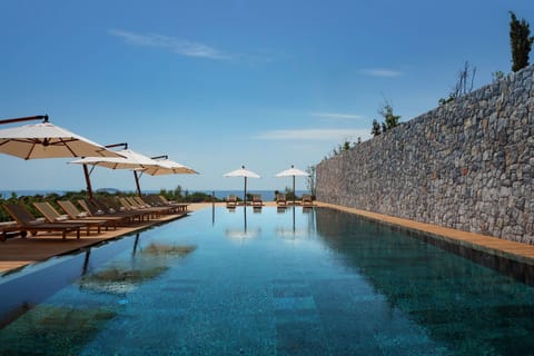Indoor pool, seasonal outdoor pool, pool umbrellas, sun loungers