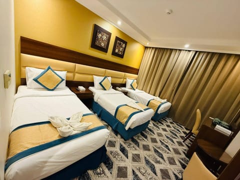 Basic Quadruple Room, City View | Premium bedding, memory foam beds, in-room safe, blackout drapes