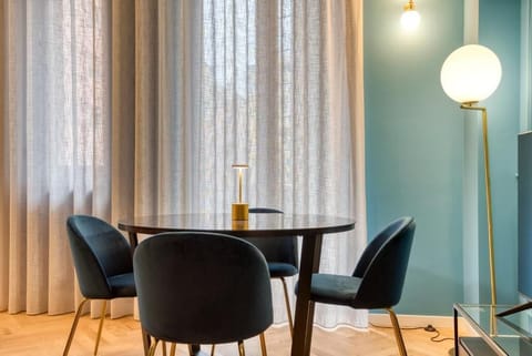 Deluxe Apartment, Balcony, City View | Living area | 50-inch Smart TV with cable channels