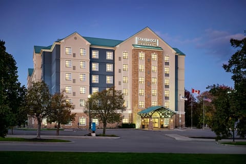 Property exterior illuminated at dusk with evening lighting.