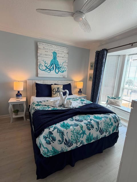 Coastal-inspired bedroom with bright window nook and stylish ocean decor