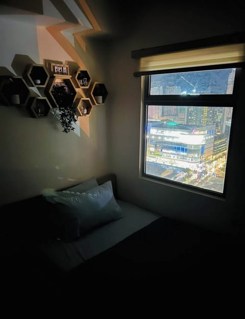 Basic Studio, Air conditioning, City View | Living area | 32-inch Smart TV with digital channels