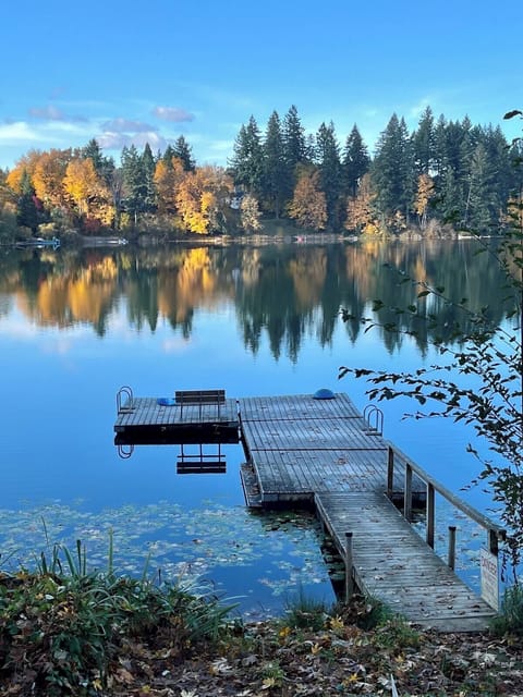 Private neighborhood dock with autumn lake reflections