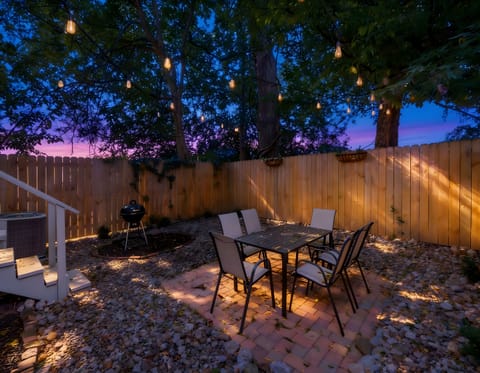 Enjoy a lovely dinner outside on the sturdy dining chairs while admiring the gorgeous sunset sky. We designed this peaceful yard to be the ultimate spot for unwinding after a long day.