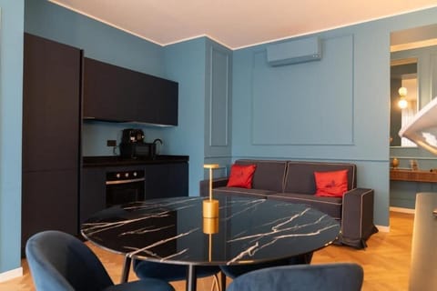 Deluxe Apartment, Balcony, City View | Living area | 50-inch Smart TV with cable channels