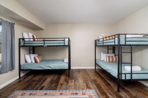 A cozy, thoughtfully styled bunk room that makes sharing space feel effortless and fun.