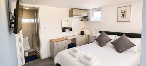 Soft bedding and calming interiors create a restful retreat.