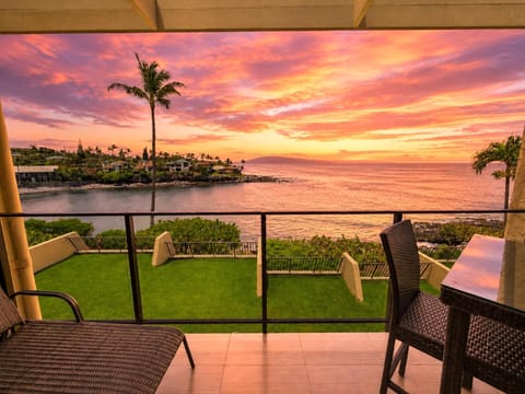 Your private lanai frames a warm Maui sunset over the water
 NAP-C19