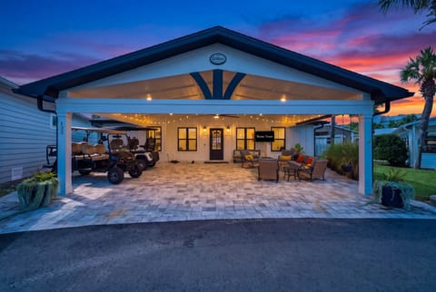 Roll in and unwind — covered parking, cozy seating, and a golden sky to greet you!