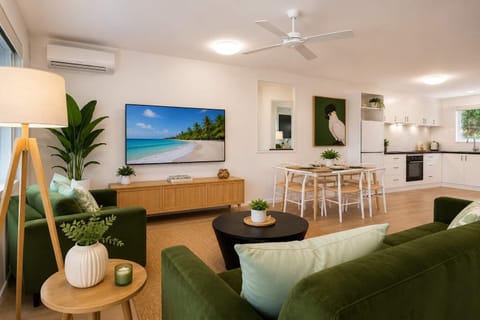 Bright Open-Plan Living Area with Smart TV & Air Conditioning