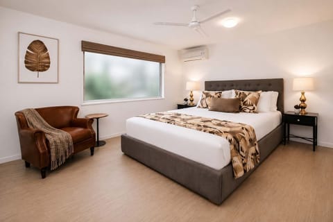 Comfortable queen bedroom with quality linens, air-conditioning and ceiling fan