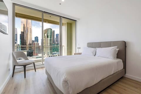 As night falls, relax in the sleeping area, where the queen bed offers a comfortable spot to wind down.