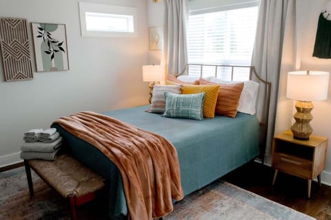 Serene Primary Suite with private balcony. Plush beading and towels. Blackout blinds and curtains for peaceful and undisturbed sleep.