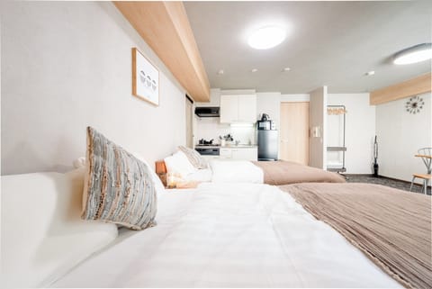 Deluxe Quadruple Room, Balcony | Down comforters, blackout drapes, WiFi (free), bed sheets