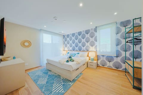 Unwind in your stylish bedroom adorned with coastal-inspired tones, plush bedding, and natural light streaming through the windows. Your private retreat awaits with modern touches and calming décor.