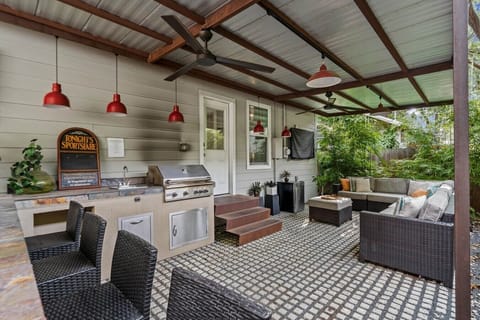 Fire up the built-in gas grill on the covered patio and gather at the bar seating for al fresco meals in the shade.