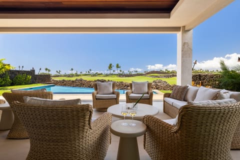Lounge in the inviting seating area beneath wood-beamed ceilings and open sightlines.