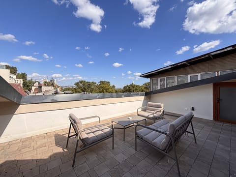 Private rooftop terrace with open sky and Hacımimi views