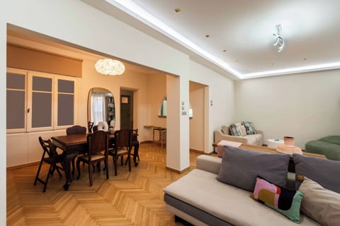 Spacious living and dining area with original 1950s wood details 