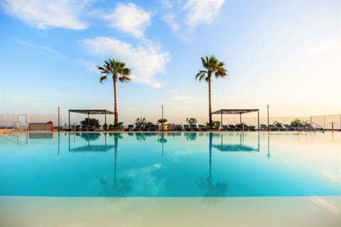 Outdoor pool, open 9:30 AM to 7:00 PM, sun loungers, lifeguards on site
